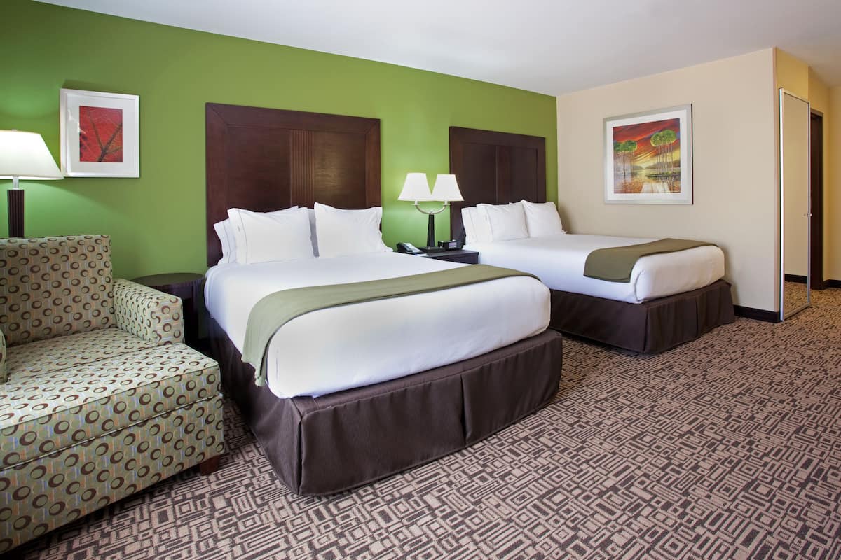 Pillowtop beds, desk, blackout drapes, iron/ironing board