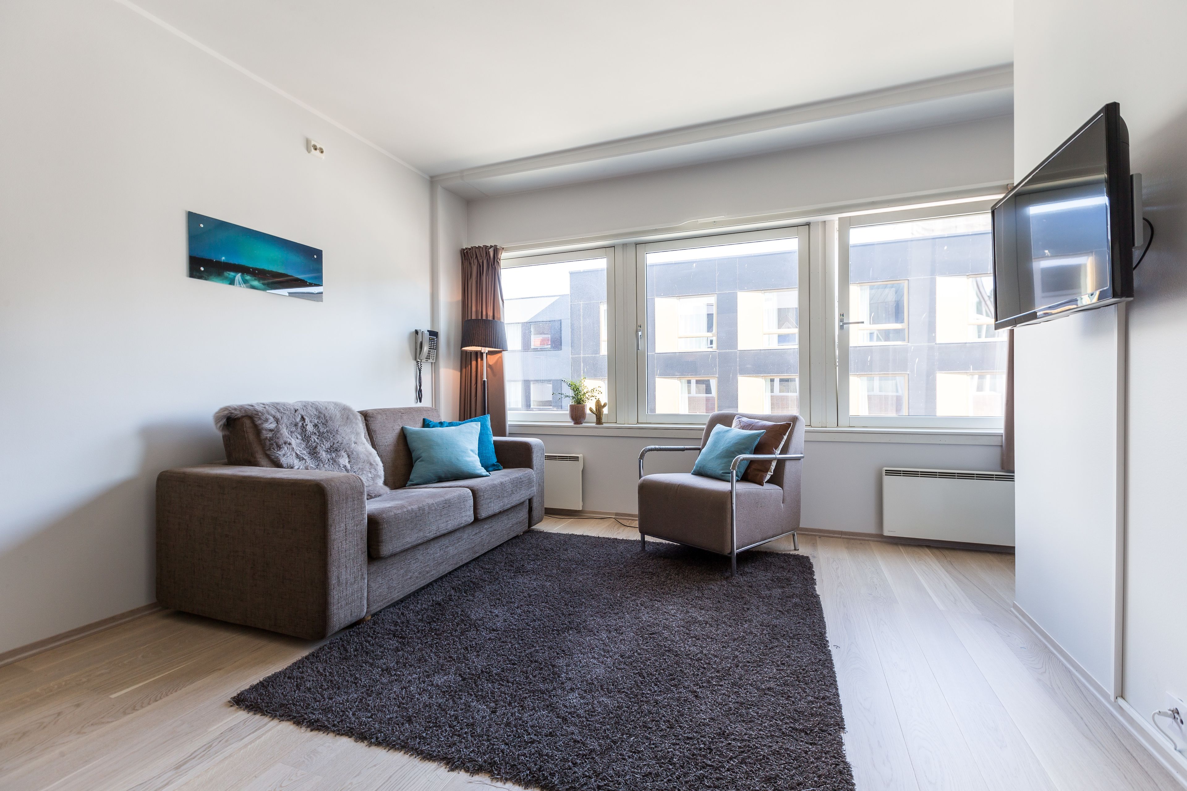 apartment, 1 bedroom, city view | living area | 32-inch lcd tv with digital channels, tv