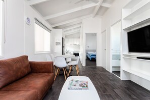 Deluxe Park Cabin | Living area | 50-inch TV with digital channels, DVD player - RACV Cobram Resort (Cobram)