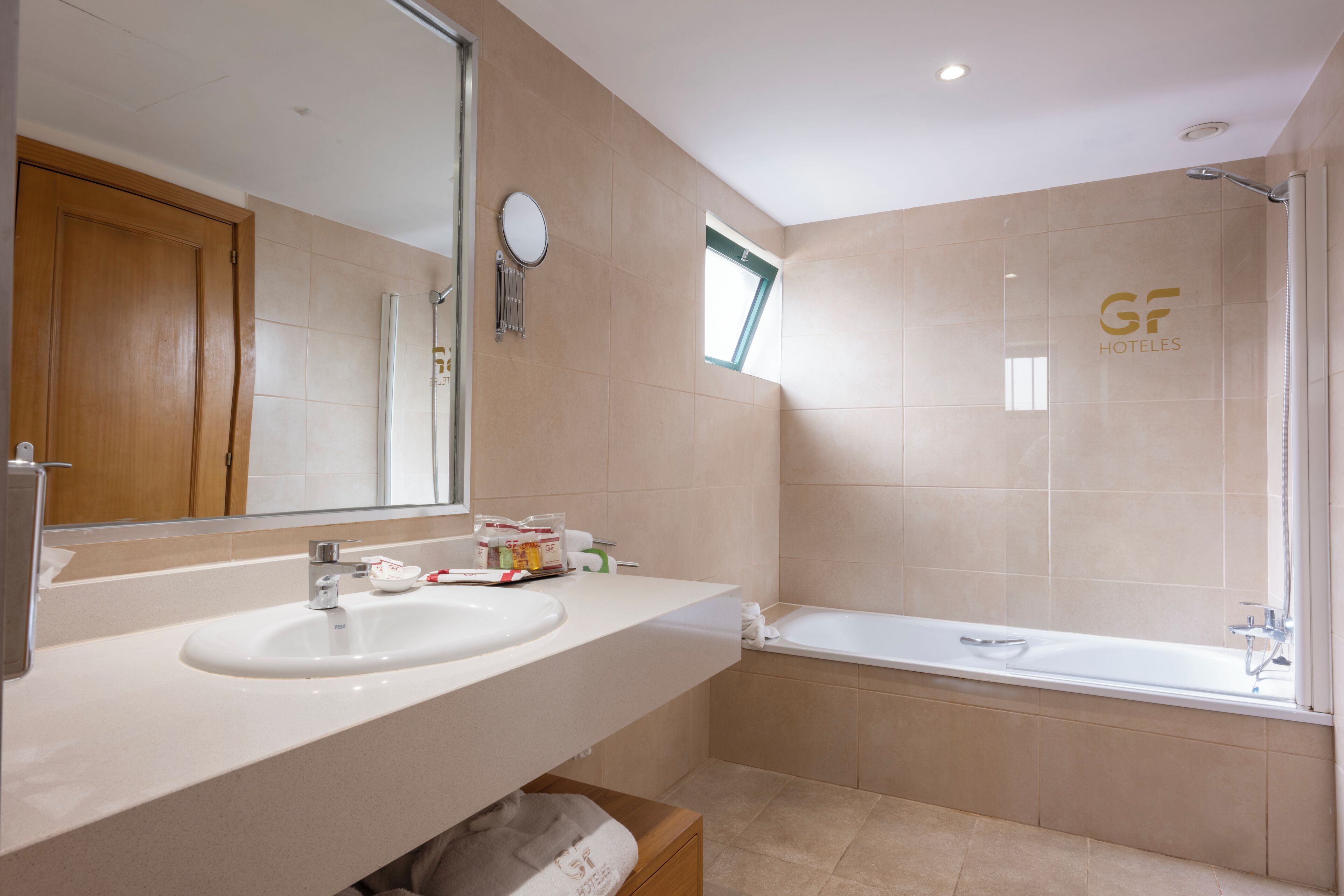 combined shower/bathtub, hair dryer, towels, soap