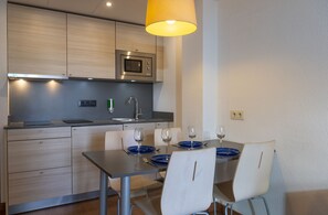 Apartment, 1 Bedroom | Private kitchen | Full-size fridge, microwave, stovetop, coffee/tea maker