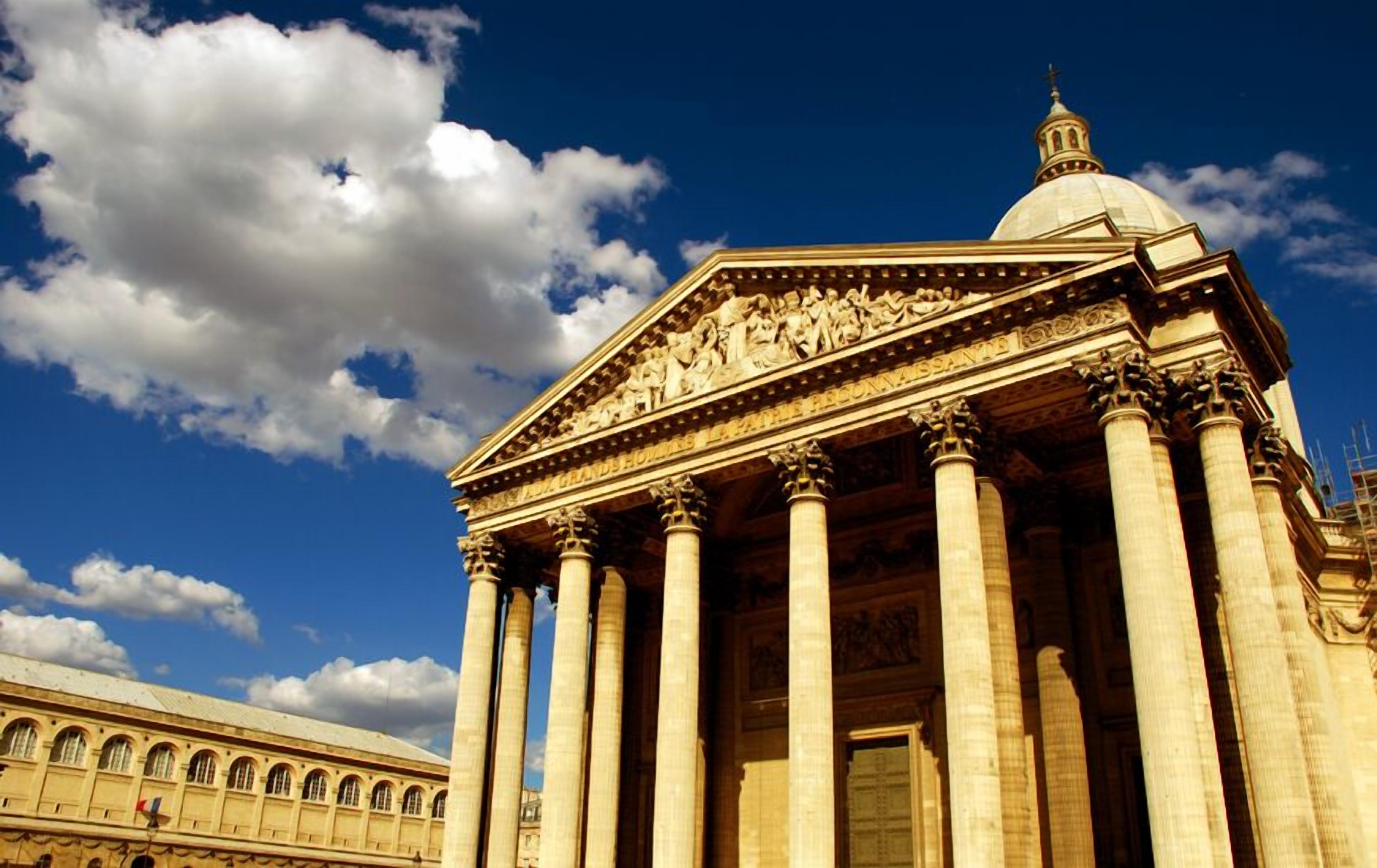 A classical building with large columns and a dome, likely a government or historical building.