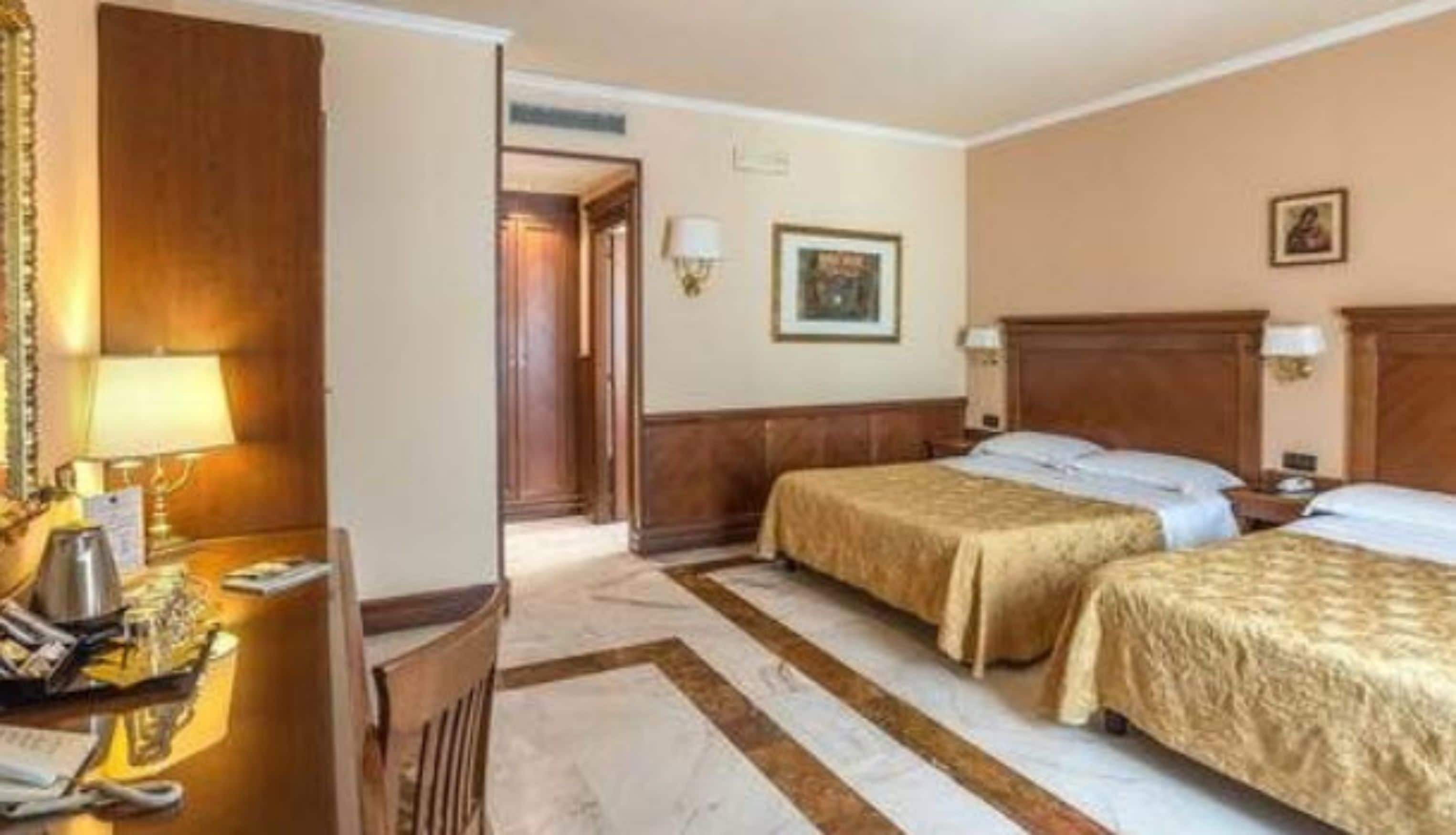 premium quadruple room, city view | minibar, in-room safe, desk, soundproofing