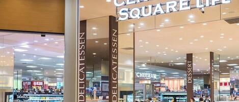 A Central Square Life store with deli and dessert sections, and a visible cheese section.