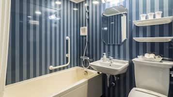 A bathroom with a bathtub, toilet, sink, and a shower.