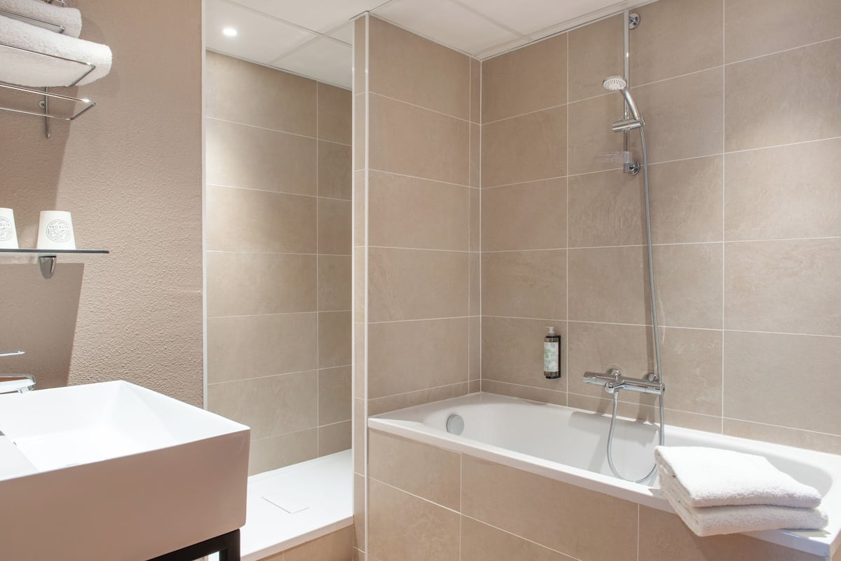 eco-friendly toiletries, hair dryer, towels, soap