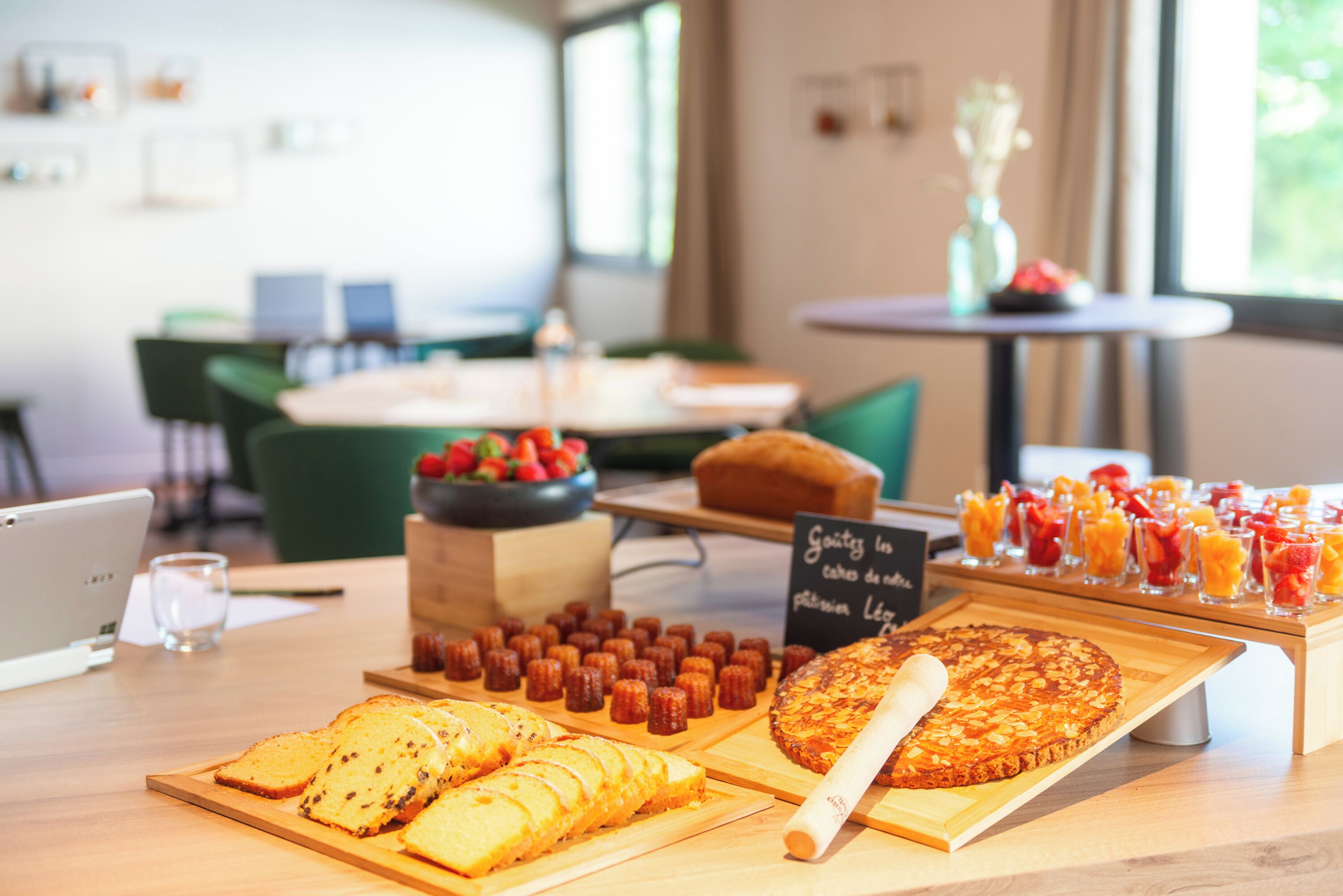 A breakfast buffet with various pastries, bread, and fruit options.