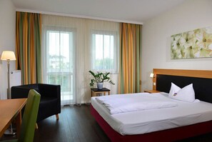 Chambre simple, 1 grand lit | Literie de qualité, coffre-fort, bureau, rideaux d’obscurcissement