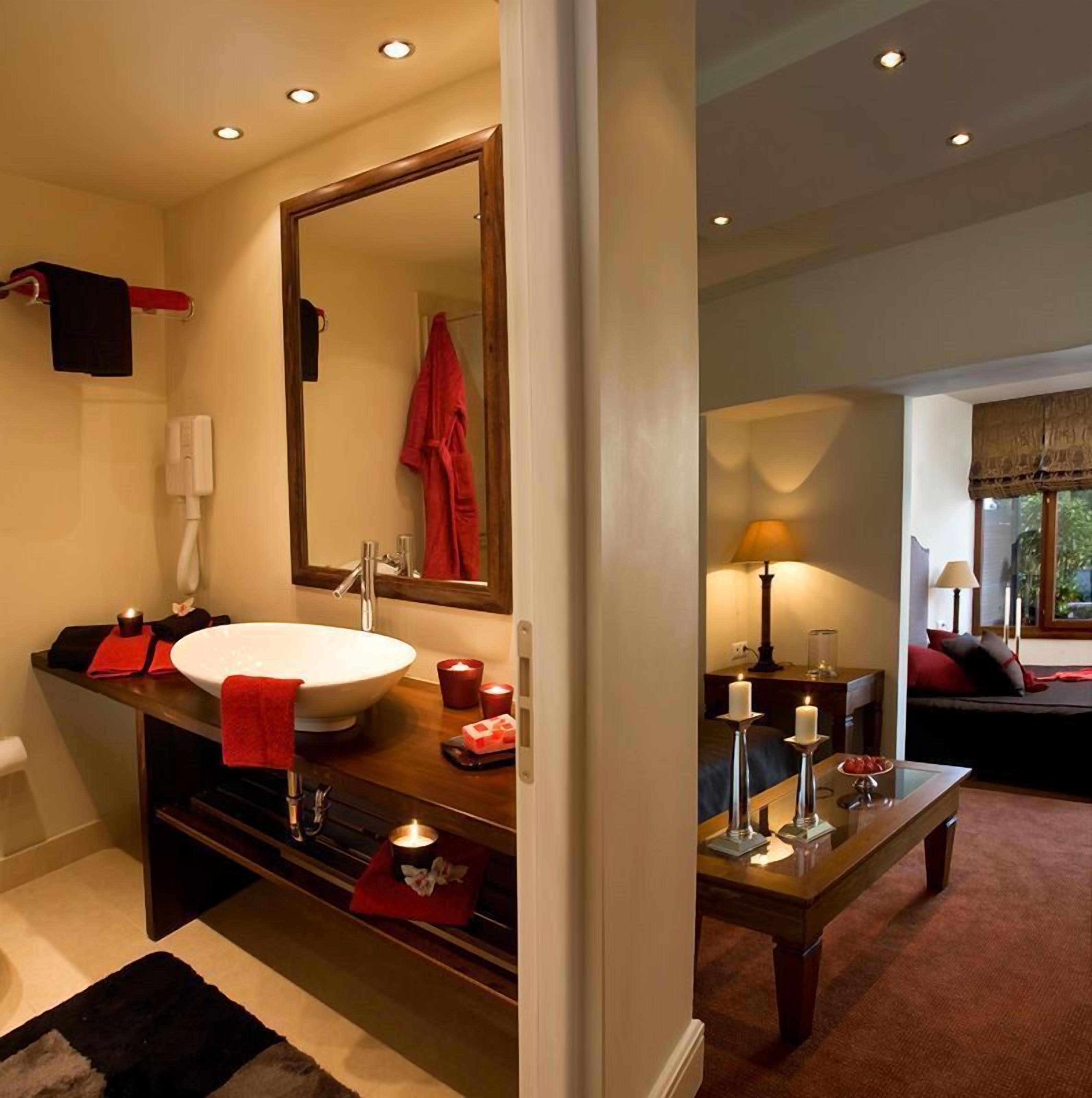 junior suite, terrace, pool view | bathroom | deep-soaking bathtub, hair dryer, towels