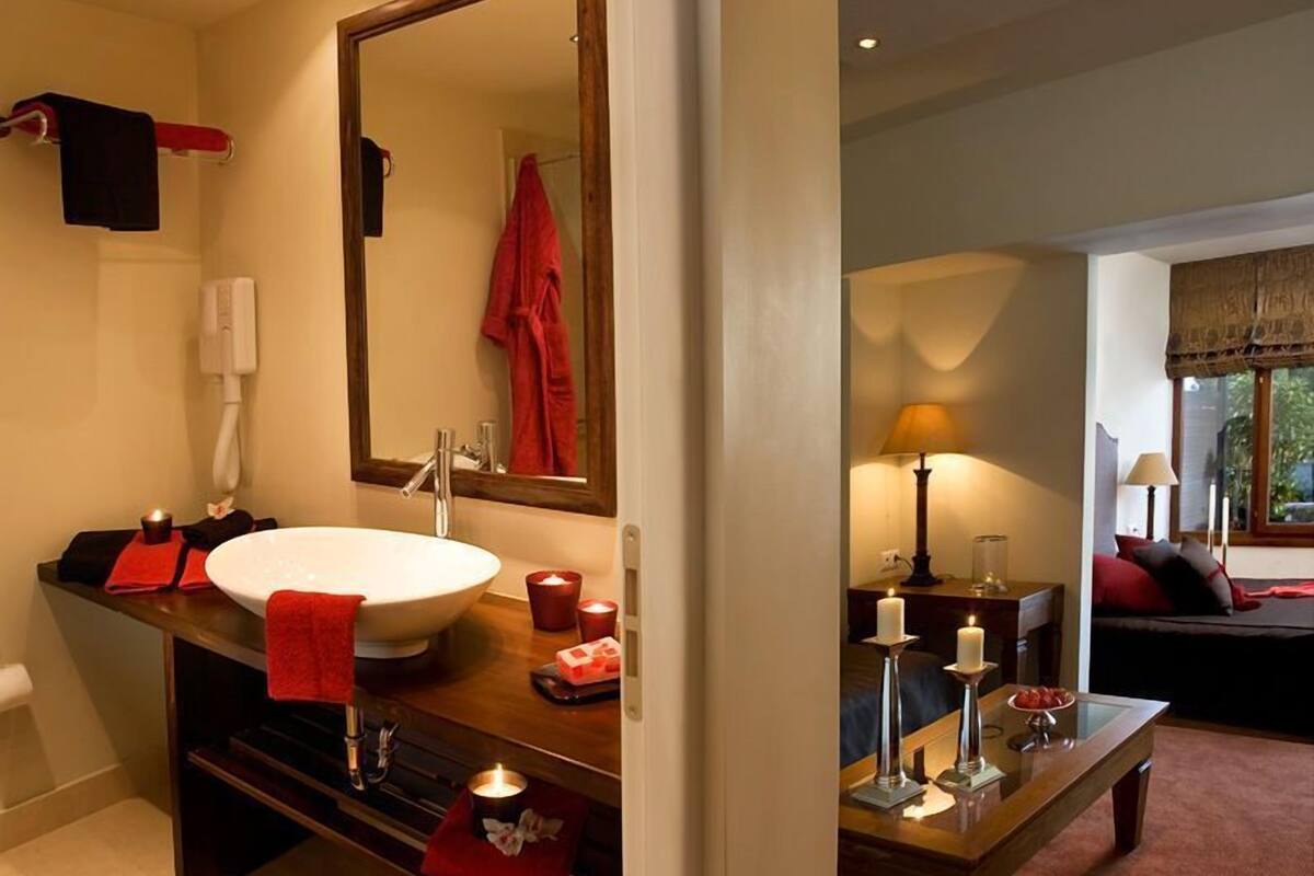 junior suite, terrace, pool view | bathroom | deep-soaking bathtub, hair dryer, towels