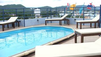 Outdoor pool, open 7:00 AM to 7:00 PM, sun loungers