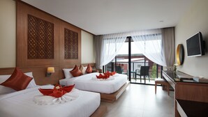 A hotel room with two beds, a desk, a TV, and a balcony with a view. - Ananta Burin Resort (Krabi)