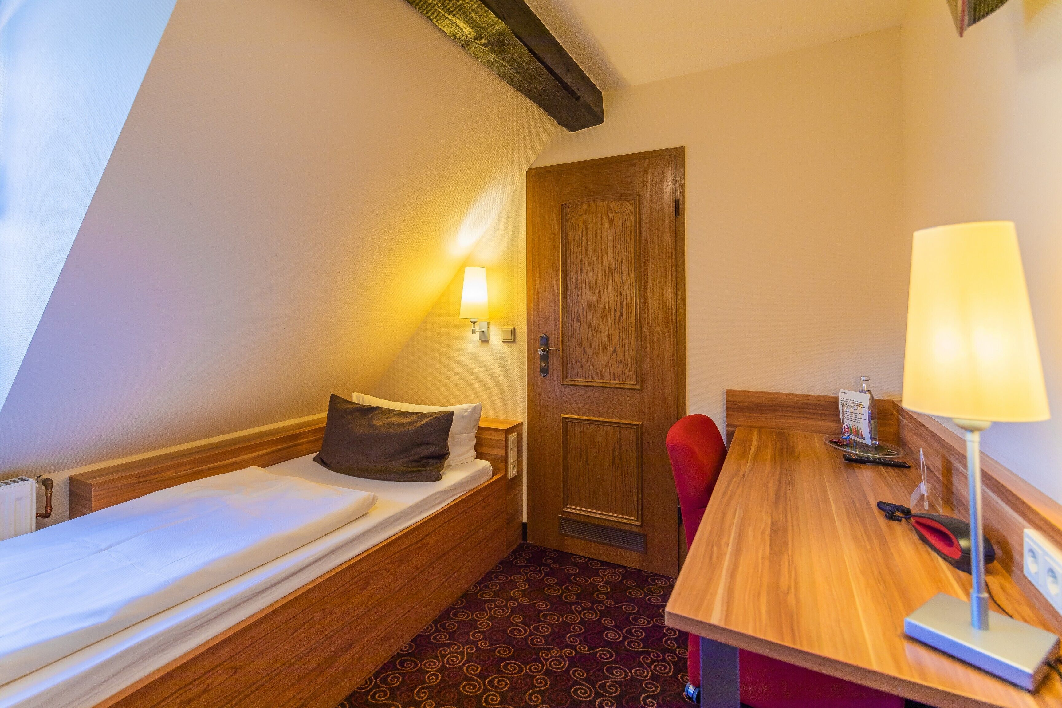 premium single room | hypo-allergenic bedding, desk, laptop workspace, travel cot