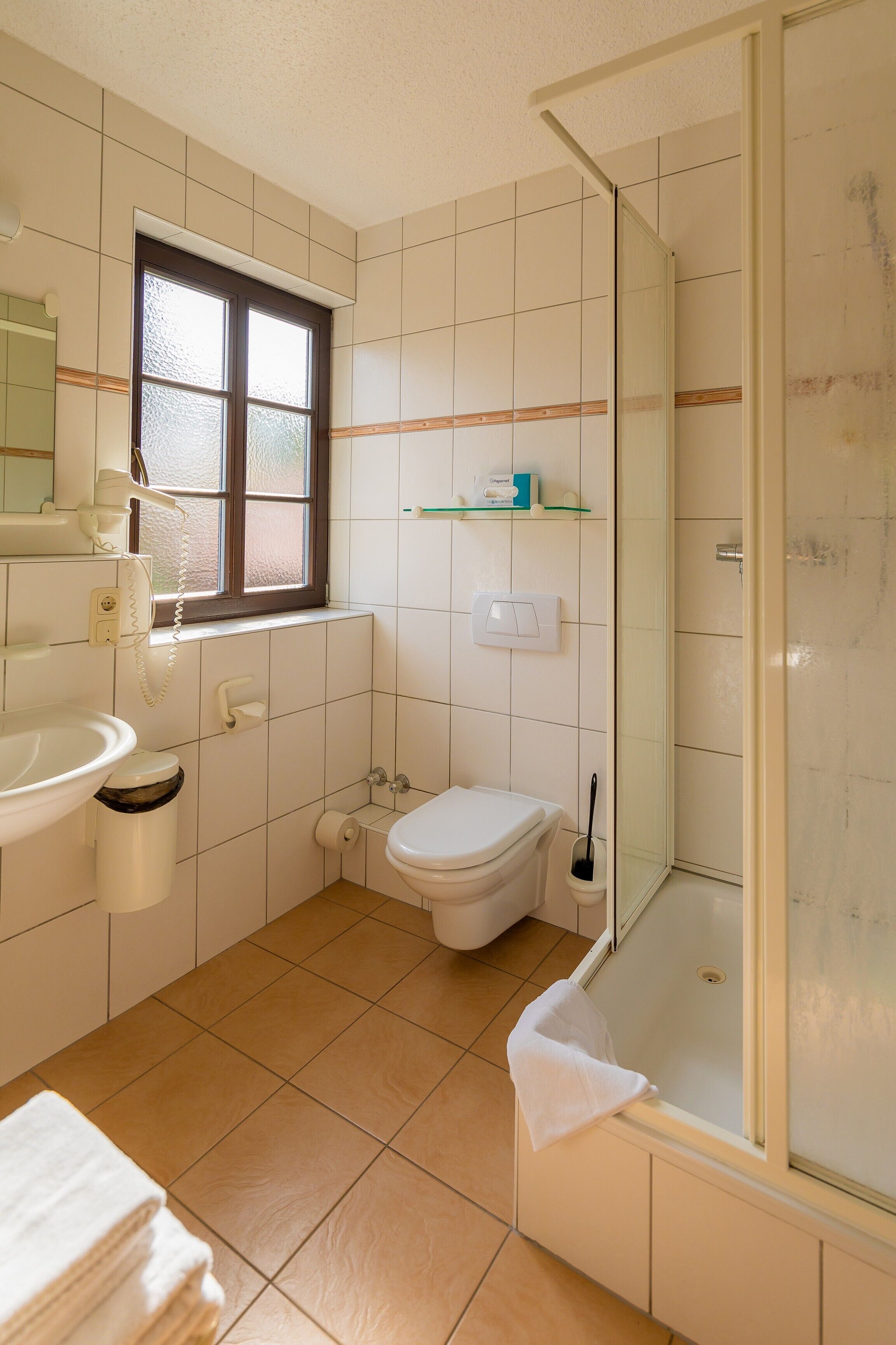 classic double room | bathroom | shower, hair dryer, towels, soap
