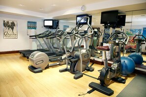 A gym with treadmills, ellipticals, and exercise balls. - Golden Tulip Al Khobar (Al Khobar)