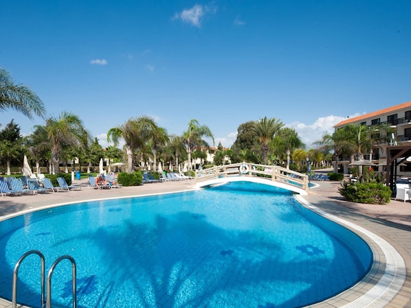 Seasonal outdoor pool, pool umbrellas, pool loungers