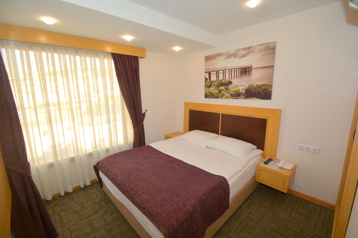 Studio Suite Standar | Seprai premium, minibar, kedap suara, dan Wi-Fi gratis