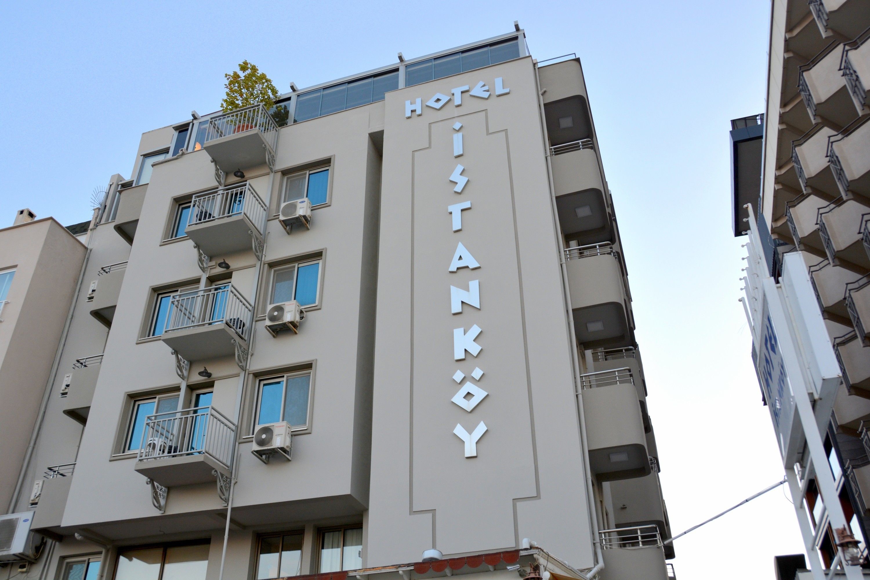 A hotel building with a sign reading "HOTEL ISTANKOY".
