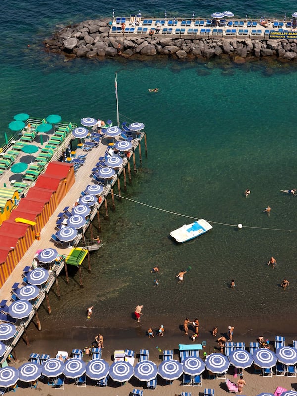 Beach nearby, black sand, sun loungers