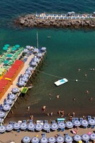 Beach nearby, black sand, sun loungers