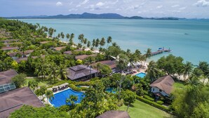A resort with a swimming pool, beach, and ocean view. - Barcelo Coconut Island Phuket (Maprao Island)