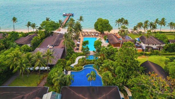 A resort with a swimming pool, beach, and ocean view. - Barcelo Coconut Island Phuket (Maprao Island)