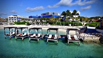 Private beach, white sand, sun loungers, beach umbrellas
