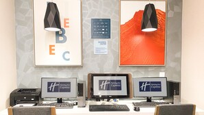A hotel work area with three computers, a printer, and a desk lamp. - Holiday Inn Express & Suites Frazier Park by IHG (Lebec)