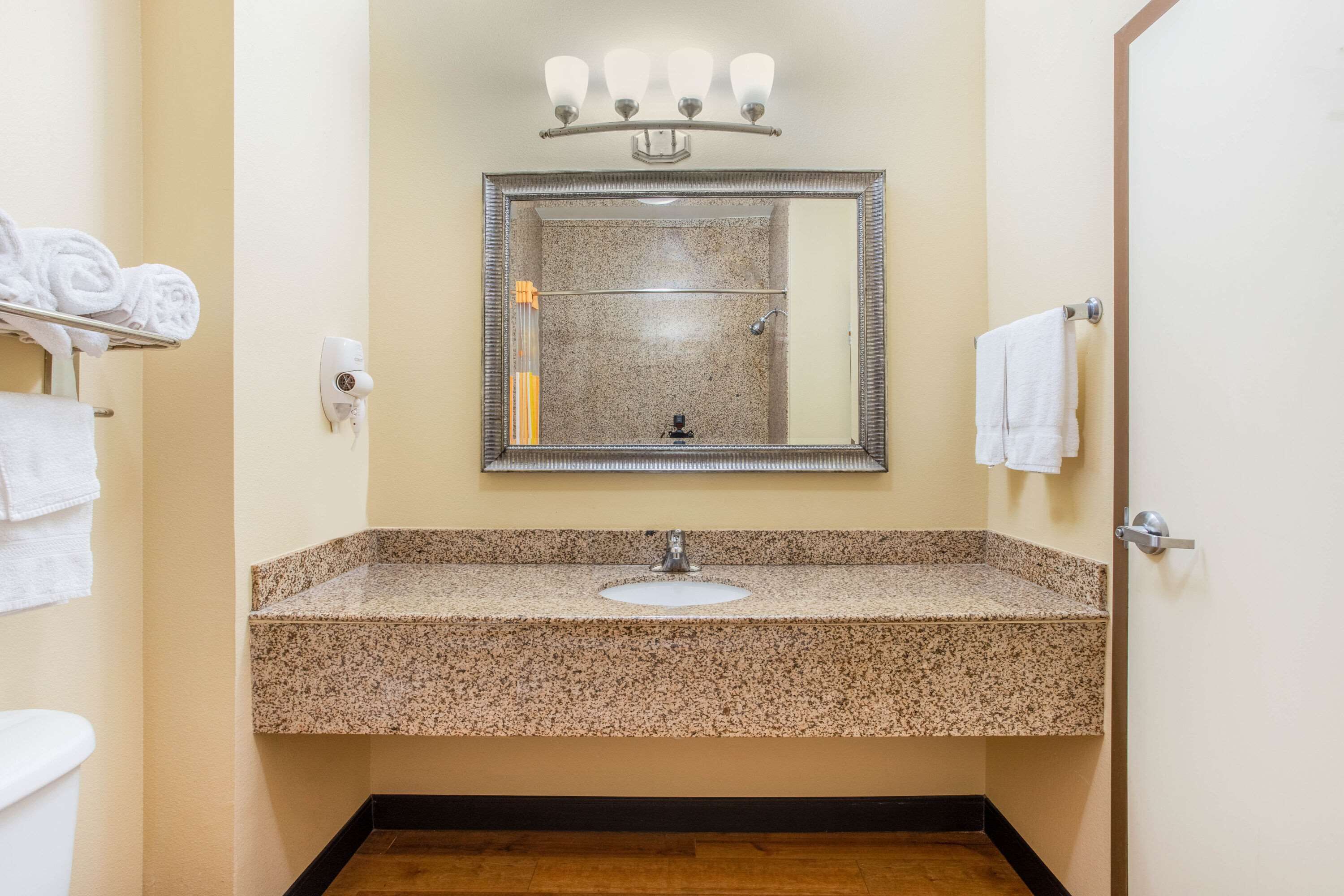 premium bedding, pillow-top beds, desk, blackout curtains