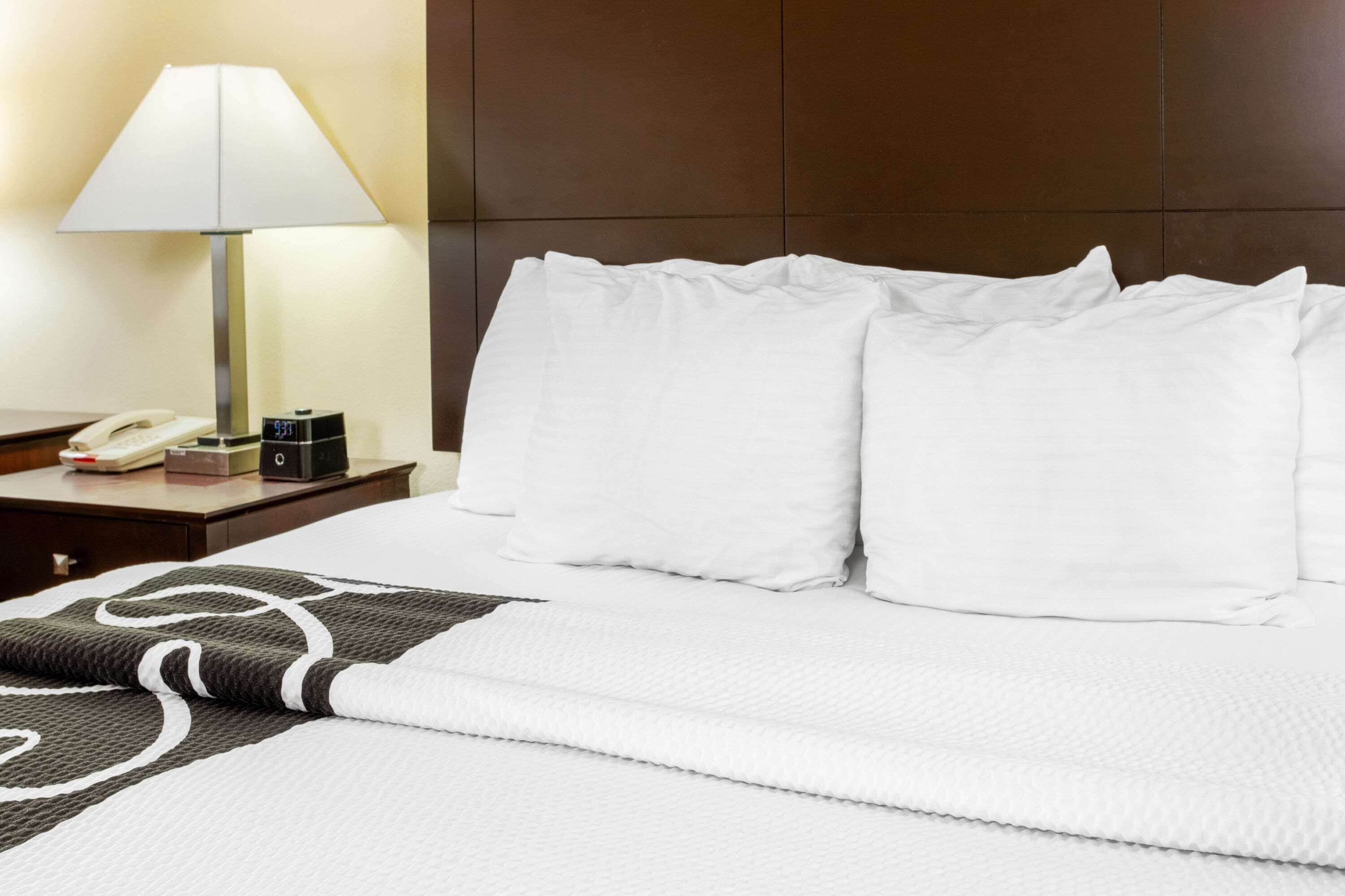 premium bedding, pillow-top beds, desk, blackout curtains