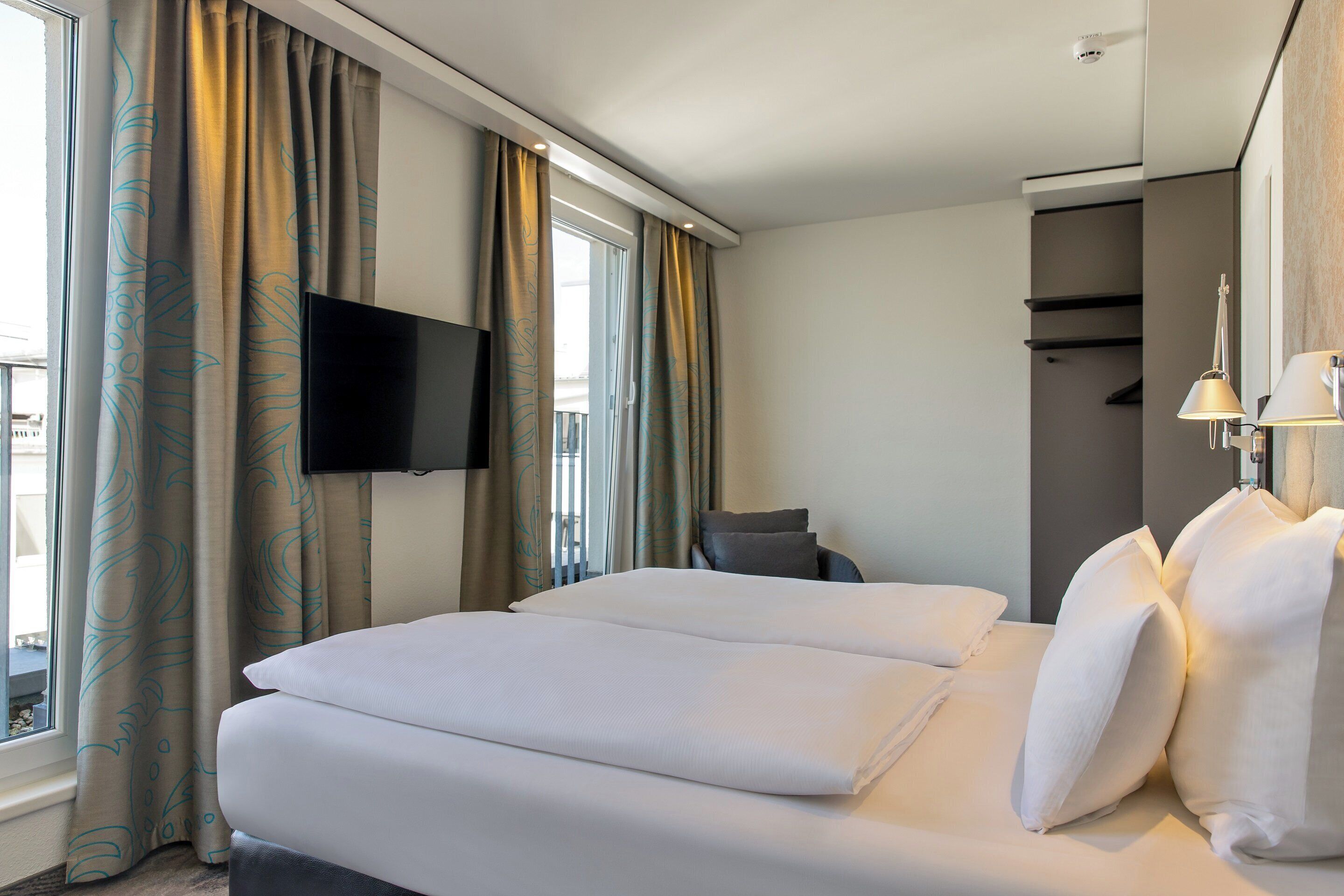 hypo-allergenic bedding, desk, blackout curtains, soundproofing