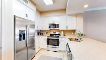 Condo, 4 Bedrooms | Private kitchen | Coffee/tea maker, cookware/dishes/utensils, dining tables