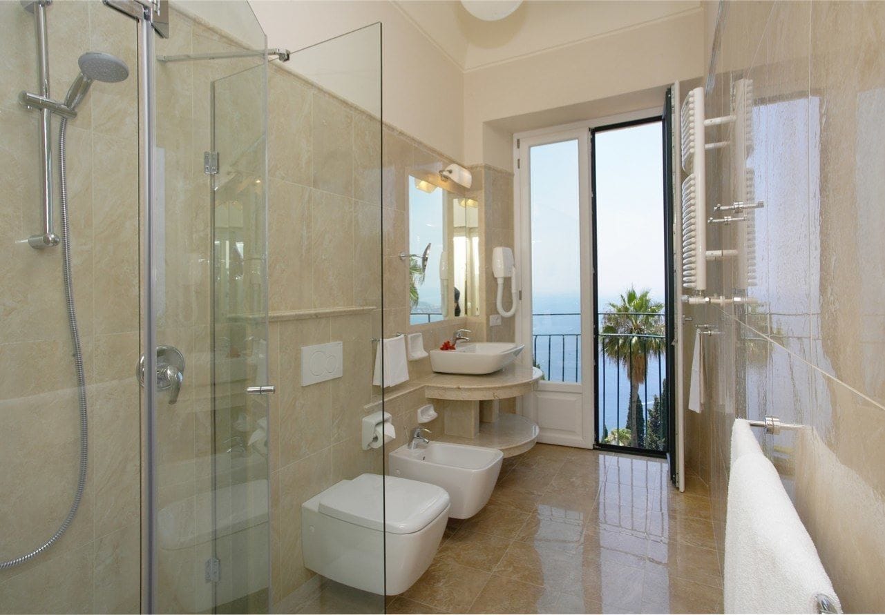 classic room, 1 double or 2 single beds, sea facing | bathroom | designer toiletries, hair dryer, bathrobes, bidet