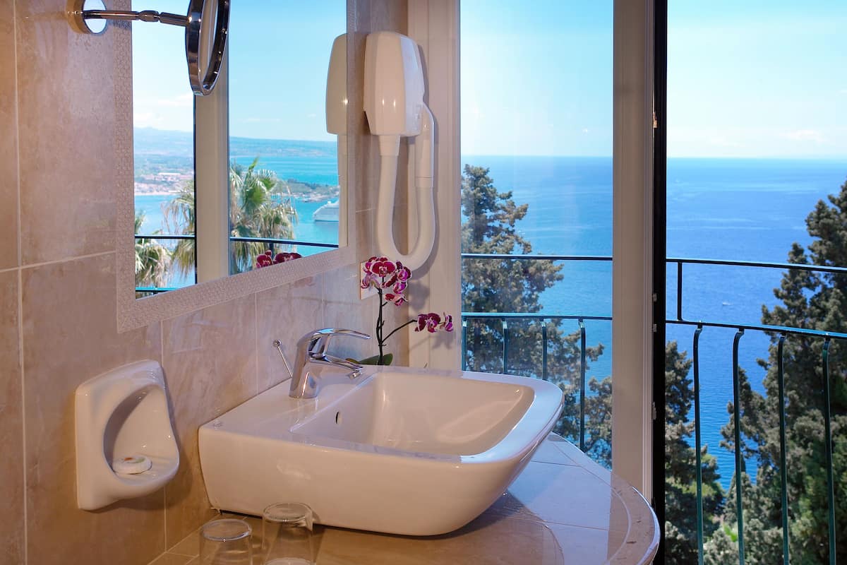 classic room, 1 double or 2 single beds, sea facing | bathroom | designer toiletries, hair dryer, bathrobes, bidet