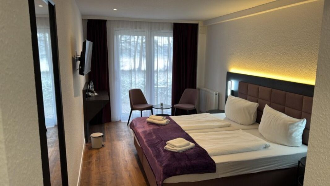 Comfort Triple Room | Minibar, in-room safe, desk, laptop workspace