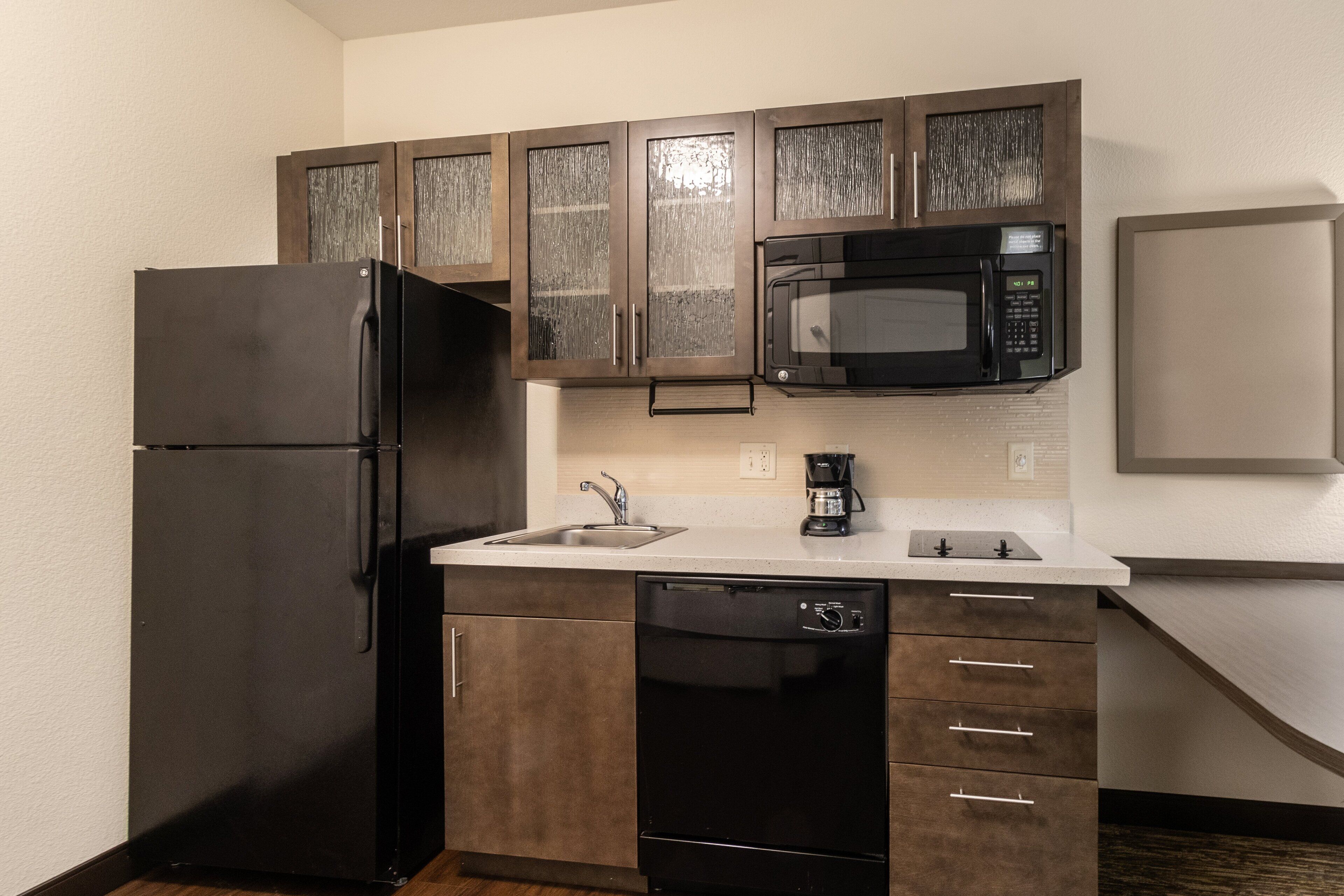 full-sized fridge, microwave, stovetop, dishwasher