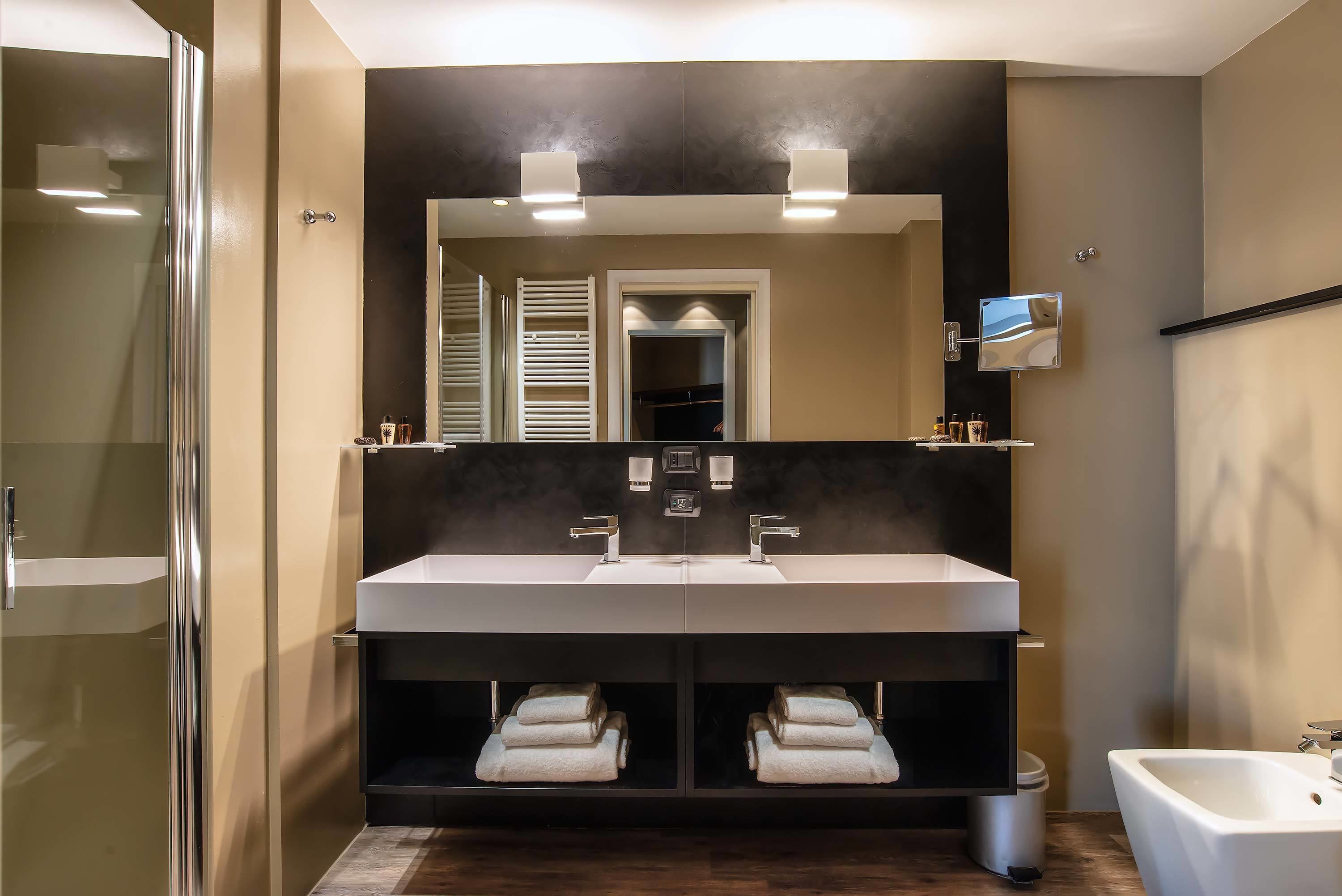 shower, hair dryer, bidet, towels