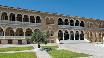 A large building with multiple arches and a central courtyard.