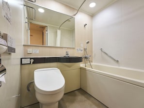 A bathroom with a toilet, sink, mirror, and bathtub. - Daiwa Roynet Hotel Nagoya Station (Renewal Open in May 2026) (Nagoya)