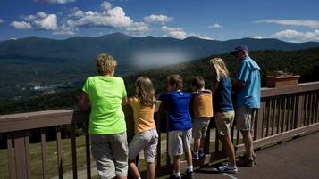 Guests can enjoy breathtaking views of the surrounding mountains from the expansive deck.