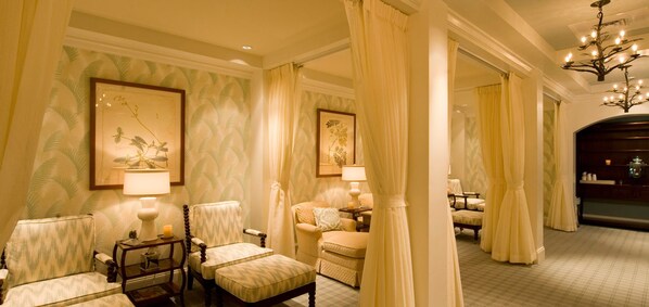 A luxurious room with a large window, a chandelier, and a framed botanical print on the wall. - Omni Mount Washington Resort & Spa (Bretton Woods)