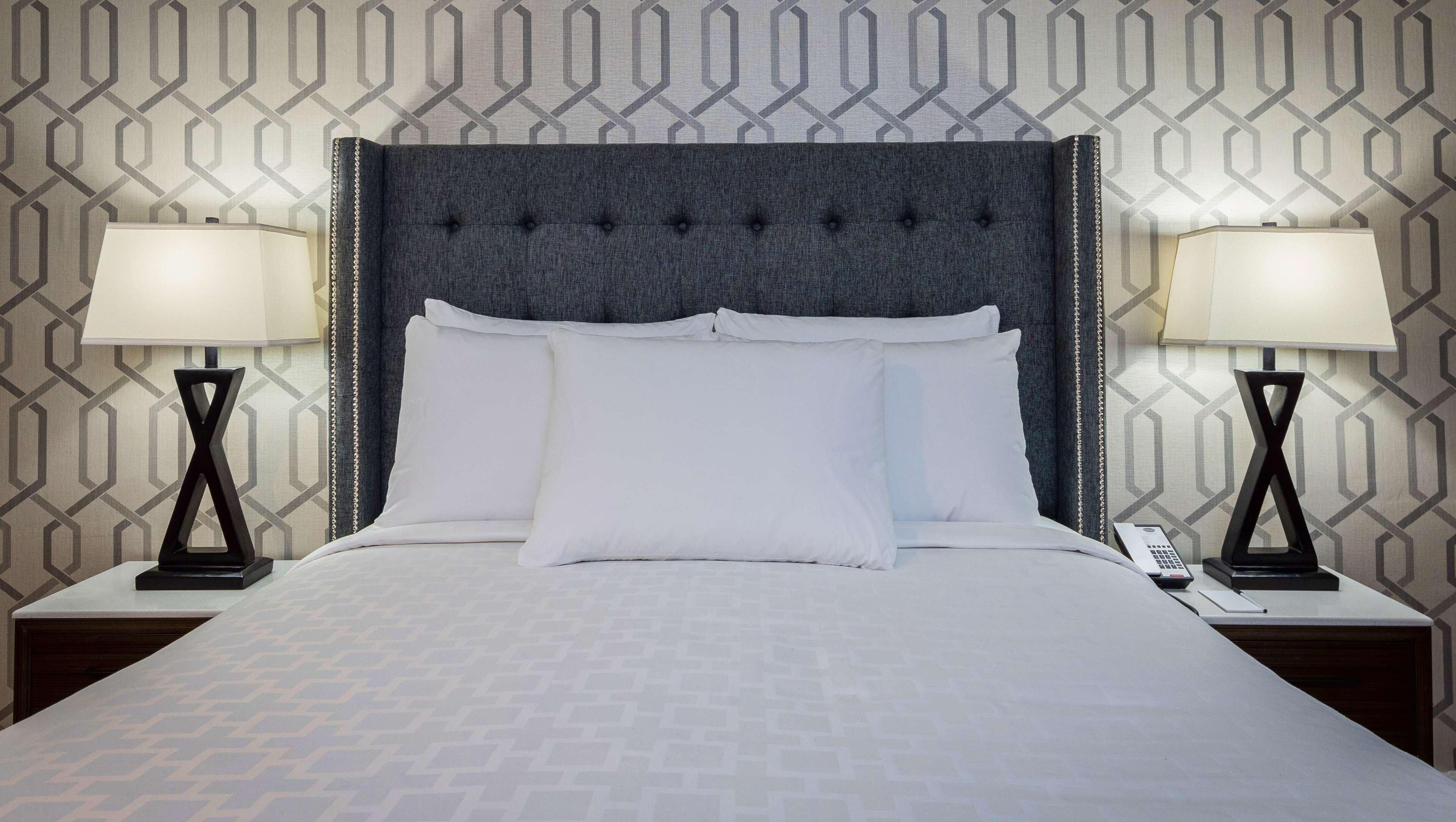 Premium bedding, desk, laptop workspace, iron/ironing board