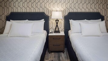 Premium bedding, desk, laptop workspace, iron/ironing board