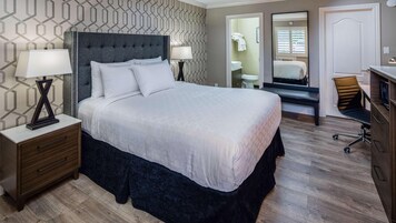 Premium bedding, desk, laptop workspace, iron/ironing board