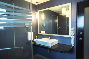 Luxury Pool View Suite | Bathroom | Shower, free toiletries, hair dryer, towels - Regenta Baywatch Resort Goa (Colva)