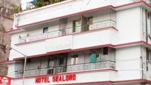 A multi-story building with balconies and a sign indicating it is a hotel named "HOTEL SEALORD". - Hotel Sea Lord (Mumbai)