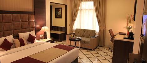 Habitación ejecutiva | Ropa de cama de alta calidad y minibar