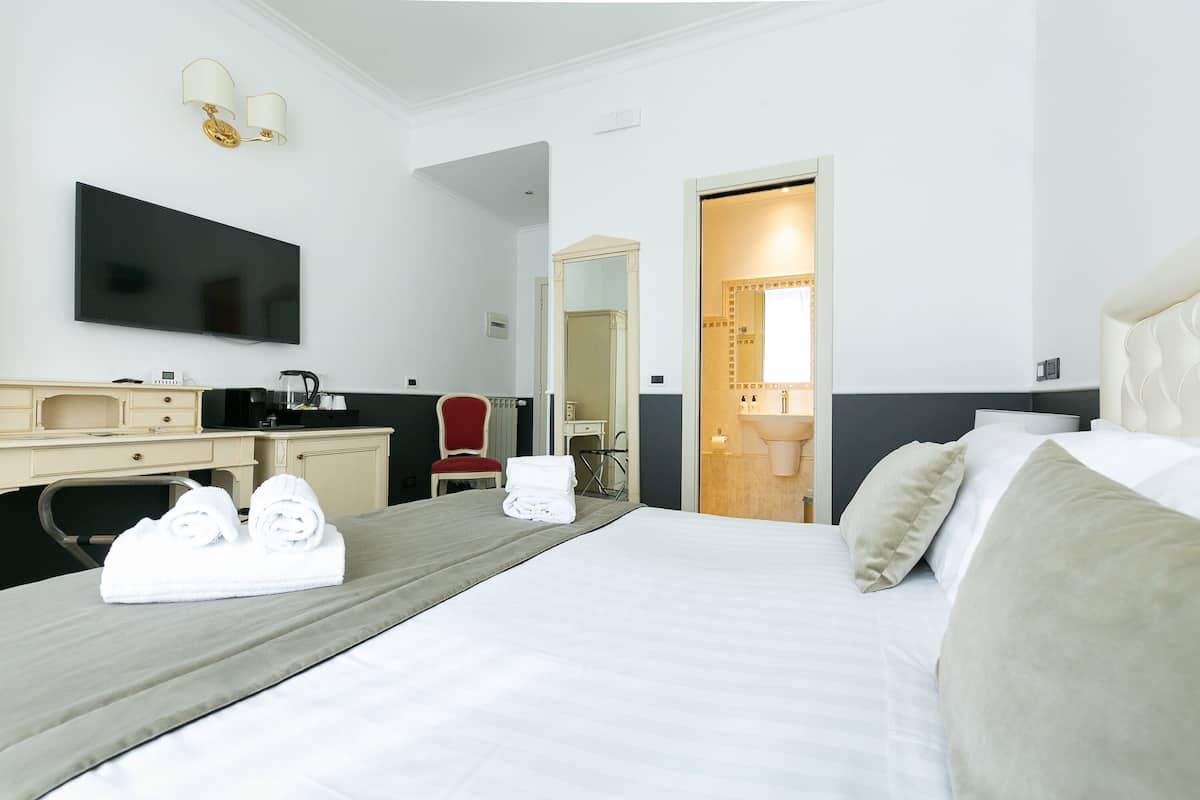 Premium bedding, down duvets, memory-foam beds, in-room safe