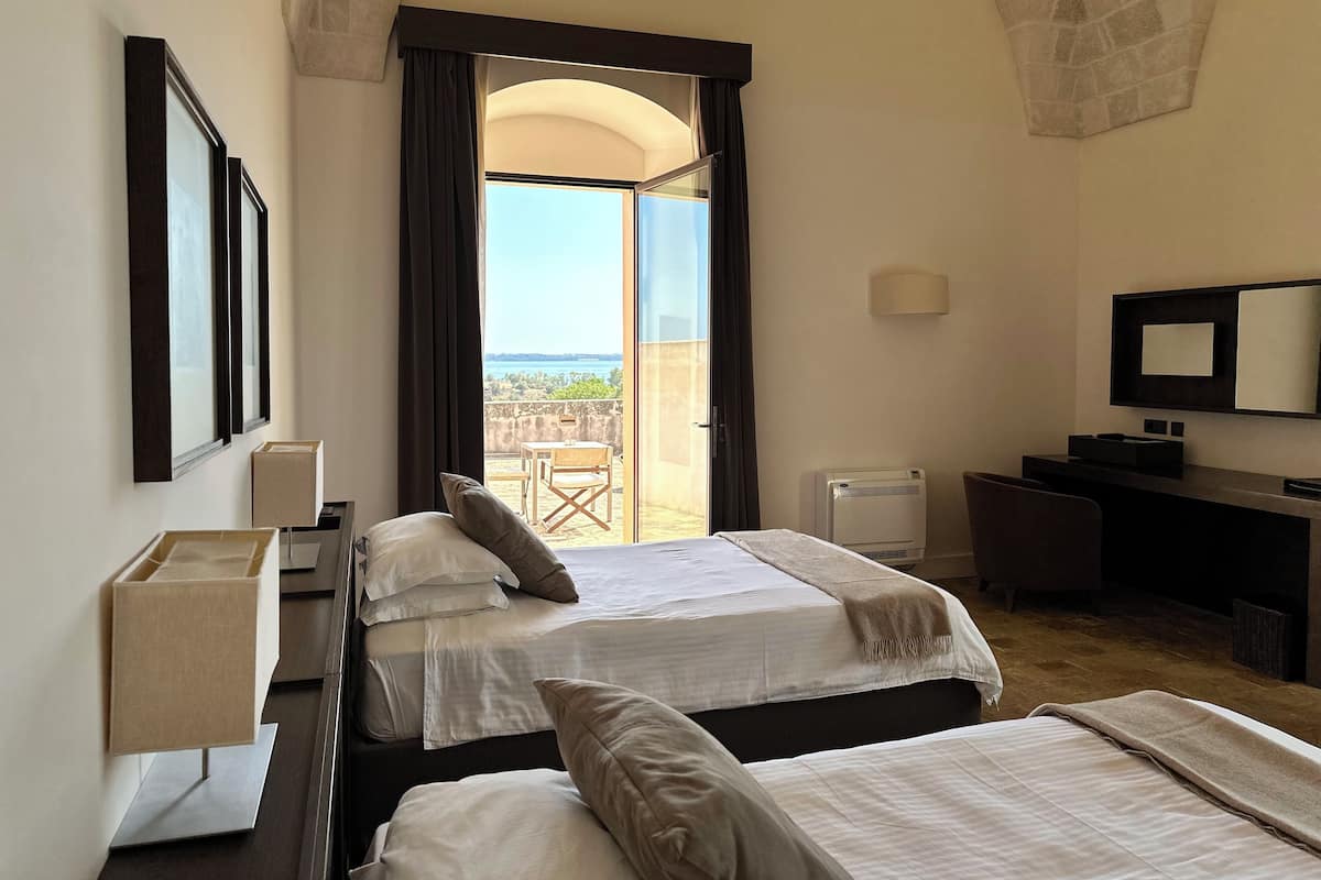 Premium bedding, down comforters, minibar, in-room safe