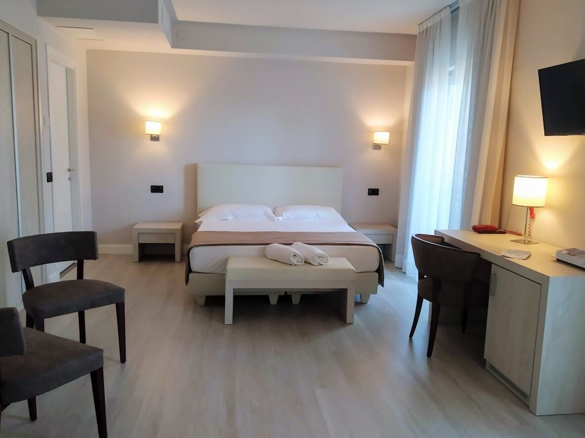 Deluxe Quadruple Room, Terrace | Minibar, in-room safe, blackout curtains, soundproofing